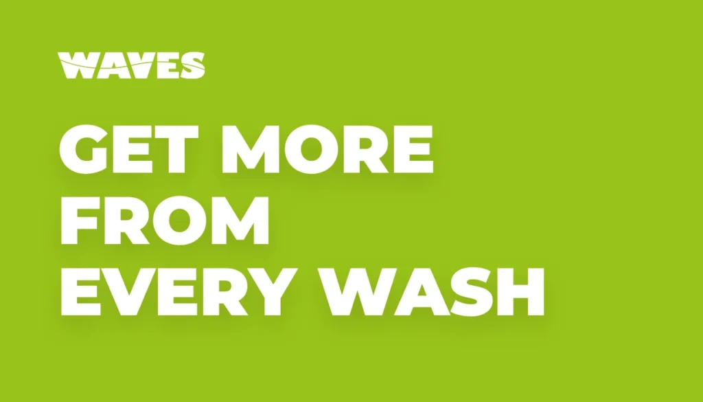 Waves Wash team member presenting complimentary car-care amenities